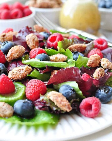 Spring Salad with Mixed Berries, Candied Almonds, and Honey Citrus Vinaigrette ~ a beautiful, delicious salad with vibrant flavors and varied textures | FiveHeartHome.com