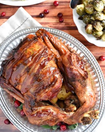 Maple-Glazed Turkey with Bacon and Sage Butter ~ tender, juicy, and shingled with bacon, this is the BEST Thanksgiving turkey recipe you'll ever try! | FiveHeartHome.com