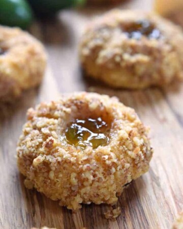 Savory Thumbprint Cookies on wooden board.