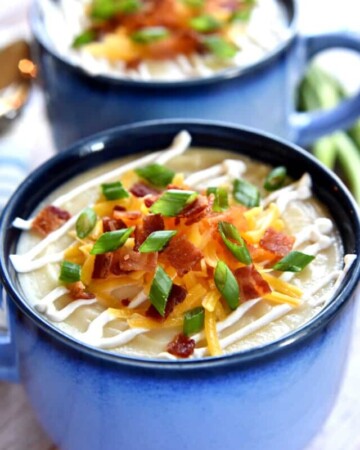 Slow Cooker Loaded Baked Potato Soup ~ a smooth and creamy crock pot soup garnished with a variety of toppings, from sour cream and shredded cheese to crispy bacon and green onions | FiveHeartHome.com