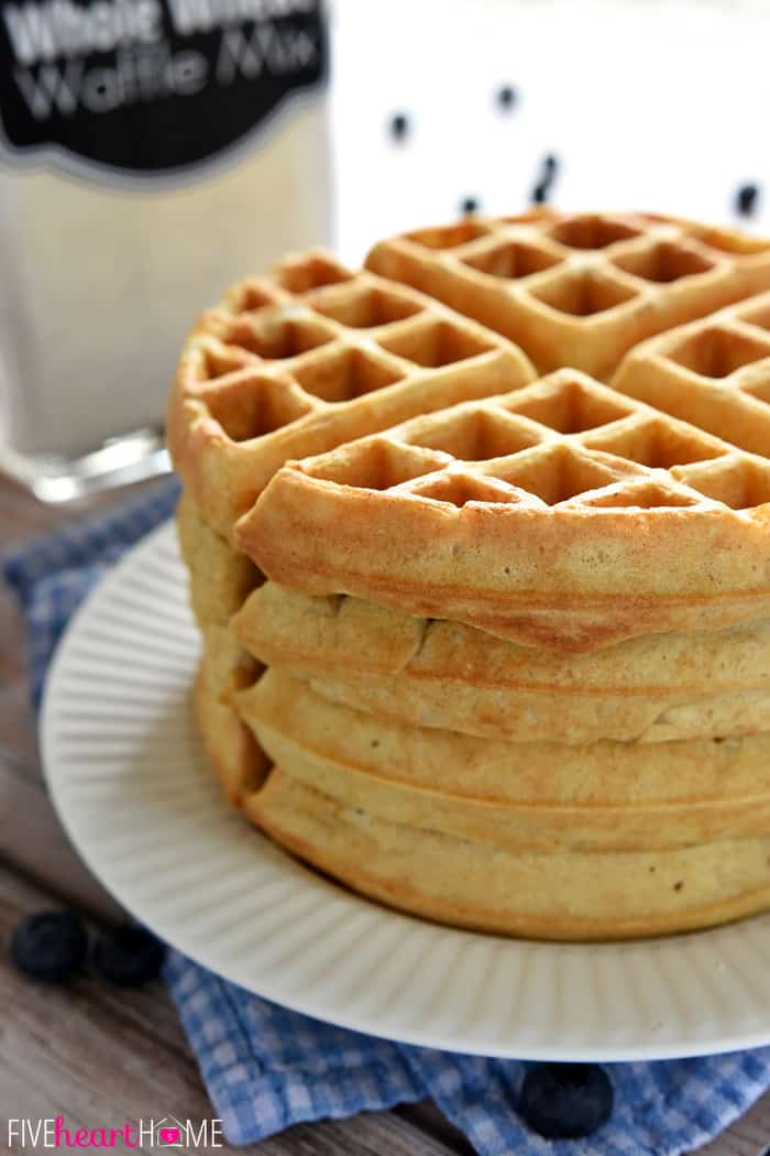 Stack of fresh waffles made with Waffle Mix on plate.