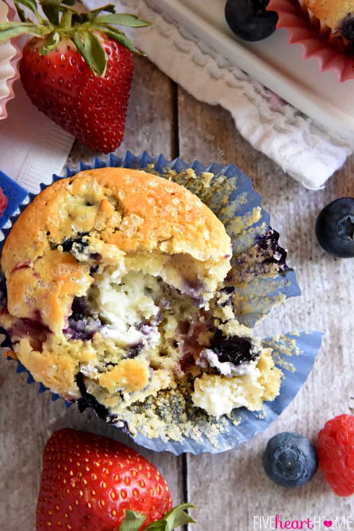 Muffin in wrapper with missing bite.