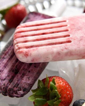 Close-up of Yogurt Popsicles in strawberry and bluebery flavors.