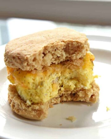 Freezer Breakfast Sandwich on a plate with big bite missing.