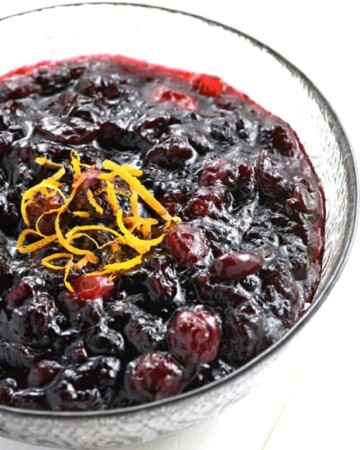 Cran-Cherry Sauce ~ sweetened with honey and brightened with citrus, this tasty twist on homemade cranberry sauce strikes a perfect balance between tart cranberries and luscious cherry preserves, making it the perfect addition to your Thanksgiving table! | FiveHeartHome.com