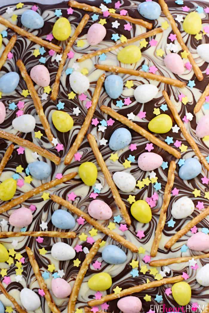 Aerial shot of Easter Bark with swirled chocolate, mini chocolate eggs, pretzels, and sprinkles