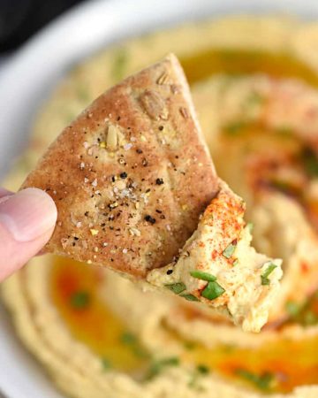 Roasted Garlic Hummus ~ mellow roasted garlic is blended with chickpeas, tahini, olive oil, and lemon juice for a fresh, creamy hummus that's delicious with homemade pita chips or crunchy veggie dippers! | FiveHeartHome.com