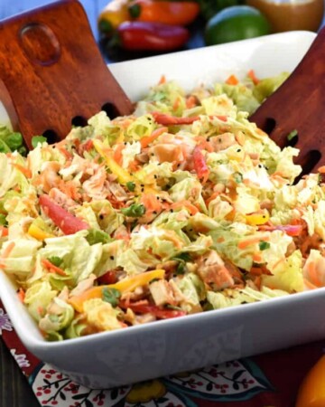 Thai Chicken Chopped Salad with Peanut Dressing ~ exploding with the contrasting flavors and textures of crunchy Napa cabbage, juicy chicken, colorful peppers, sweet carrots, salty peanuts, and fresh cilantro! | FiveHeartHome.com