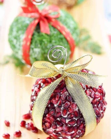 Christmas Ornament Cheese Balls ~ a fun, festive addition to your holiday party menu in three mouthwatering flavors -- Cranberry, Blue Cheese, & Pecan; Garlic, Feta, & Dill; and White Cheddar, Rosemary, & Pomegranate! | FiveHeartHome.com