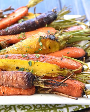 Roasted Rainbow Carrots with Thyme ~ tender and flavorful carrots make a rustic yet vibrant spring or Easter side dish that's as gorgeous as it is delicious! | FiveHeartHome.com
