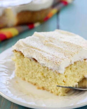 Tres Leches Cake ~ soaked with three types of milk and topped with fresh whipped cream, this sweet, moist, decadent dessert is perfect for celebrating Cinco de Mayo! | FiveHeartHome.com