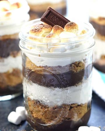 Mini S'mores Trifles ~ layered with rich chocolate pudding, crushed graham crackers, and marshmallow-laced whipped cream for a simple, yummy, no-bake dessert! | FiveHeartHome.com