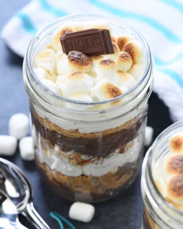 Mini S'mores Trifles ~ layered with rich chocolate pudding, crushed graham crackers, and marshmallow-laced whipped cream for a simple, yummy, no-bake dessert! | FiveHeartHome.com