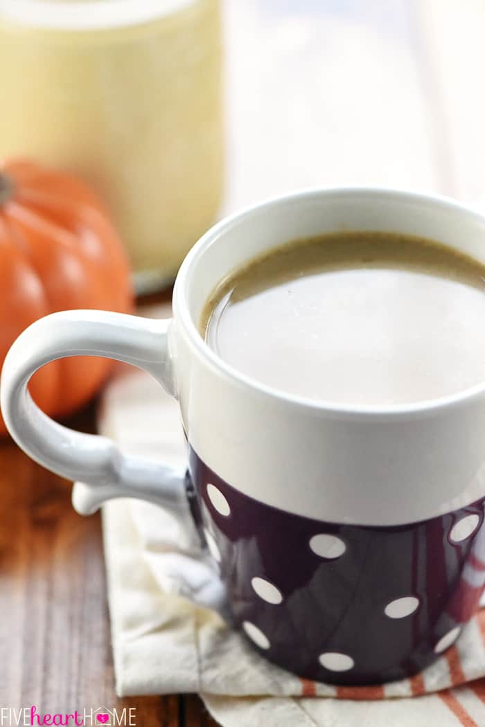 Close-up of coffee in a purple polka-dot mug.