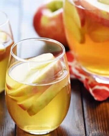 3-Ingredient Sparkling Apple Cider Sangria ~ a festive fall cocktail recipe made with white wine, apple cider, and sweet sliced Honeycrisps -- perfect for tailgating, Halloween, Thanksgiving, and even Christmas!