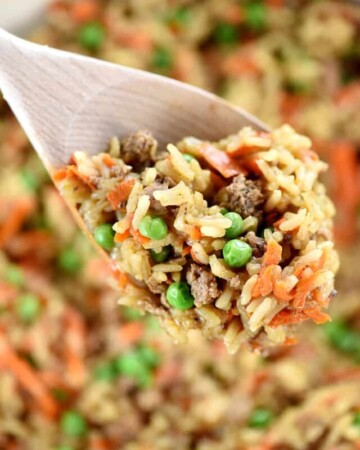 Wooden spoon scooping up Asian Ground Beef and Rice recipe.