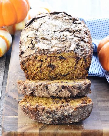 Sliced Snickerdoodle Pumpkin Bread on a cutting board