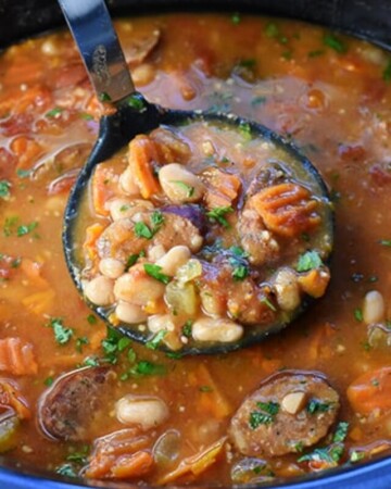 Cajun Bean Soup being ladled from slow cooker.
