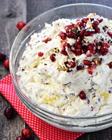 Cranberry Pomegranate Fluff Salad ~ a new twist on the classic recipe, loaded with tart cranberries, sweet pomegranate arils, crushed pineapple, toasty pecans, chewy coconut, fluffy marshmallows, and fresh whipped cream for a delicious holiday side dish! | FiveHeartHome.com