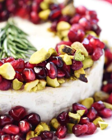 Christmas Brie ~ a simple, red-green-and-white holiday appetizer featuring Brie, pomegranate, and pistachios, garnished with a festive rosemary Christmas tree! | FiveHeartHome.com