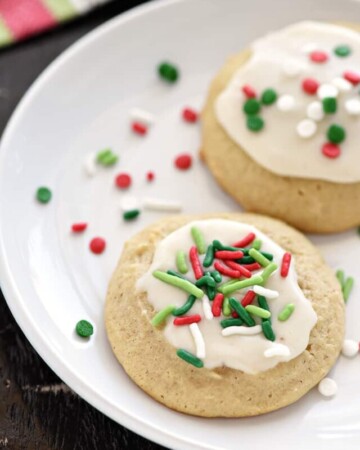 Eggnog Cookies ~ soft, tender, and delicately flavored with eggnog and spices before being topped with a sweet eggnog glaze and festive Christmas sprinkles! | FiveHeartHome.com