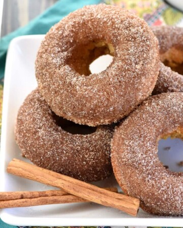 Baked Apple Cider Donuts piled on plate.