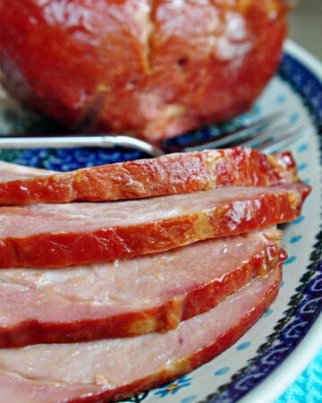 Brown Sugar Crockpot Ham sliced on platter.