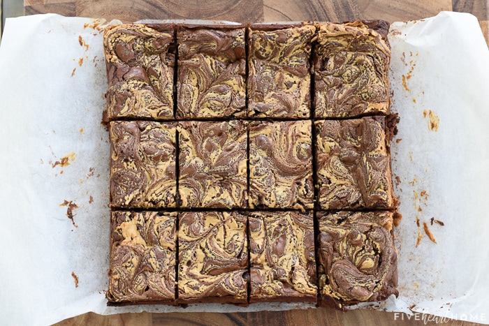 Aerial view of gluten-free Peanut Butter Brownies on parchment paper cut into bars.