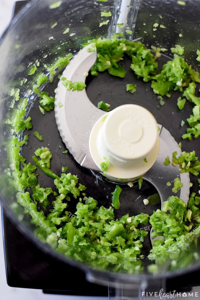 Minced jalapeños in food processor.
