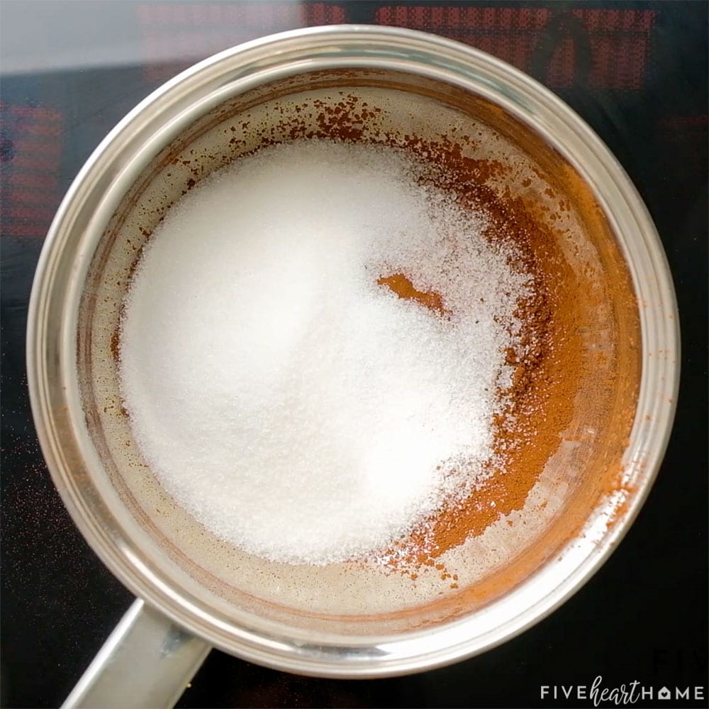 Cocoa and sugar added to pot.