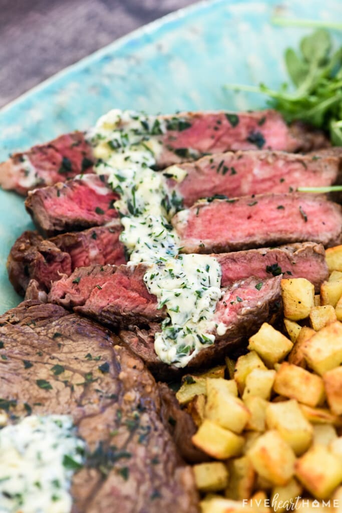 Close-up of Steak Frites with herb butter.