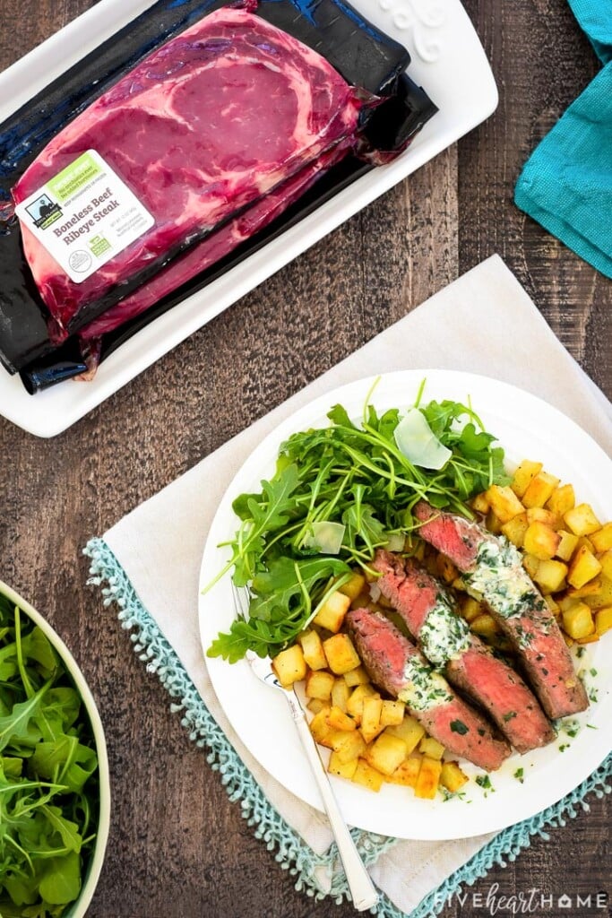 Aerial view of Steak Frites on plate made with Open Prairie Natural Ribeyes.