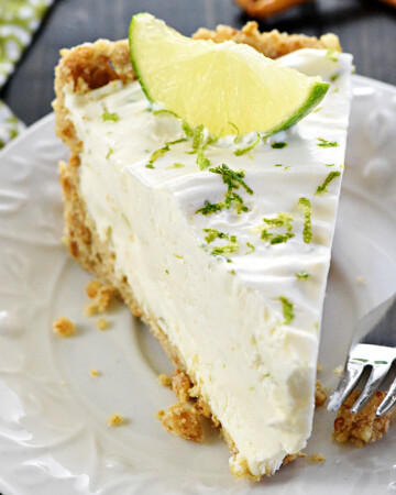 Slice of No-Bake Frozen Margarita Pie on a plate.