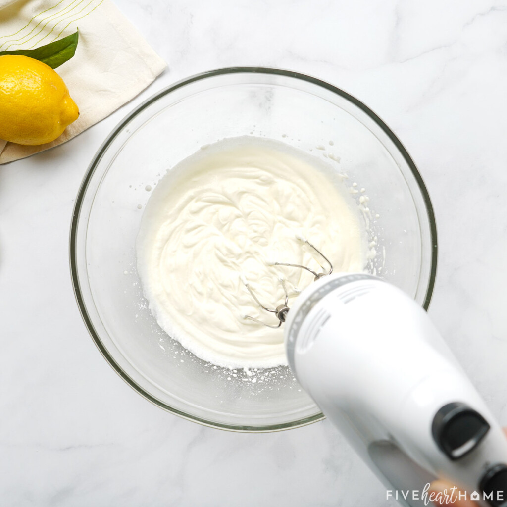 Whipping heavy cream in a bowl.