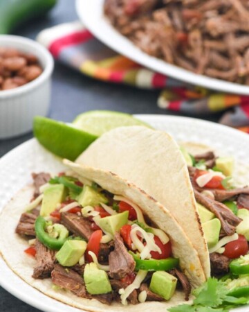 Mexican Shredded Beef Tacos with toppings.