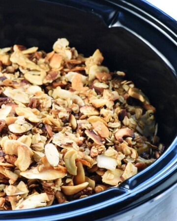 Crock Pot Granola showing close-up of slow cooker granola in crockpot.