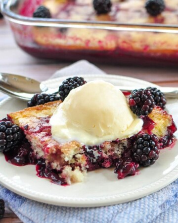Blackberry Cobbler in dish and on plate with scoop of ice cream.