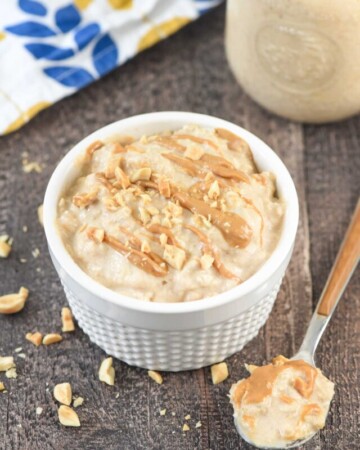 Peanut Butter Overnight Oats with spoonful on table.
