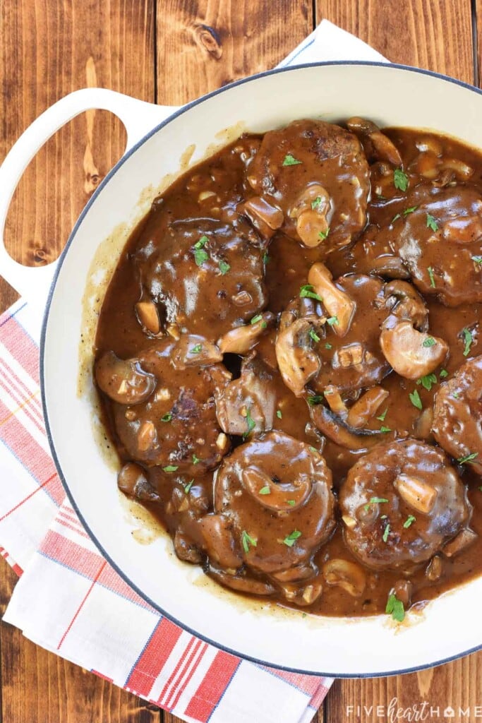 Hamburger Steak and gravy in skillet.