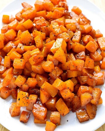 Roasted Butternut Squash recipe on white platter.