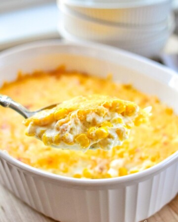 Cream Cheese Corn Casserole being scooped out of dish.