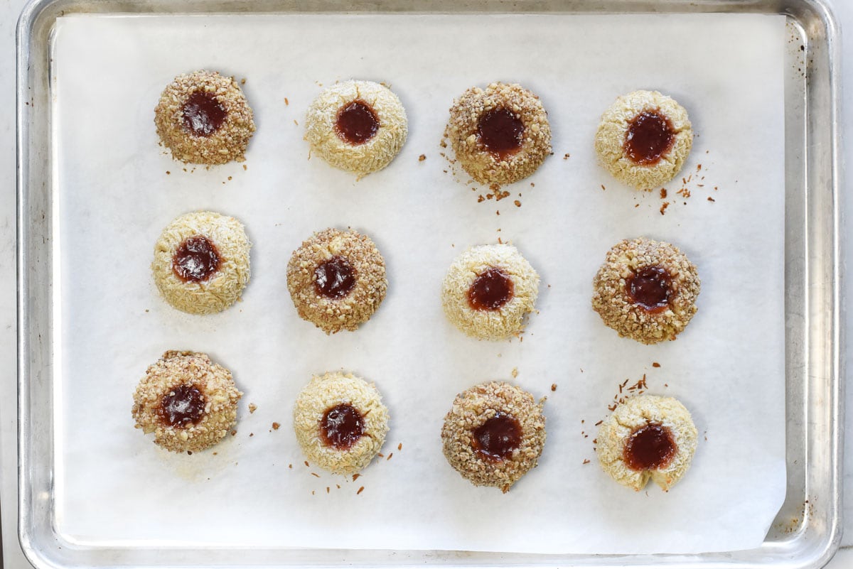 Jam Thumbprint Cookies on baking sheet, fresh out of oven.