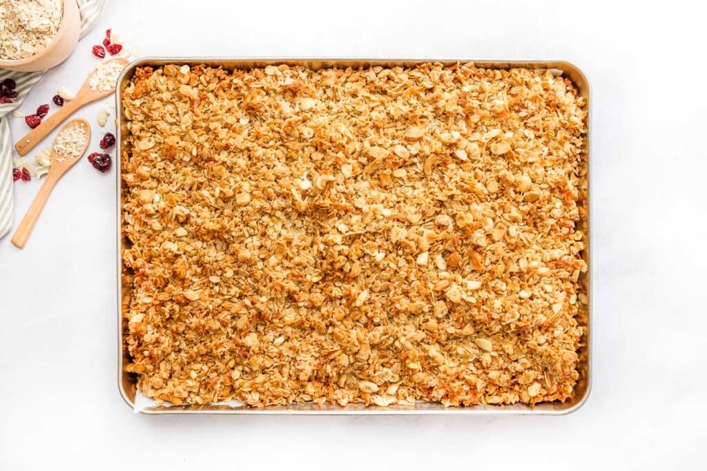 Granola, baked on pan and fresh out of the oven.
