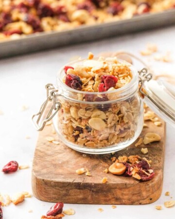 Granola cereal in glass jar.